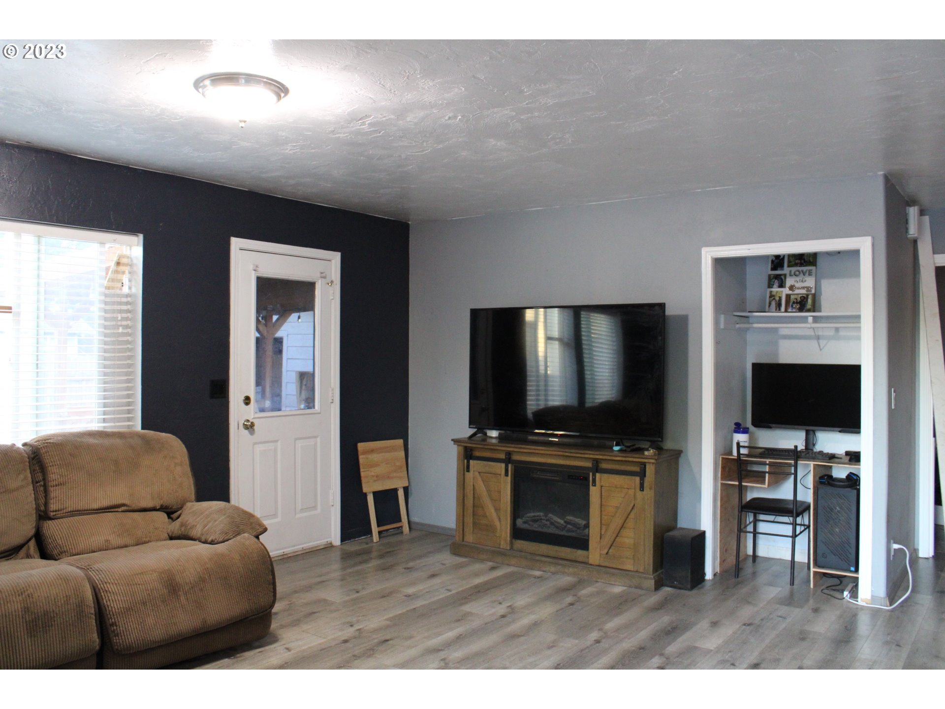230 South 34th Street Springfield, OR 97478 - Photo 8 of 29 a living room with furniture and a flat screen tv