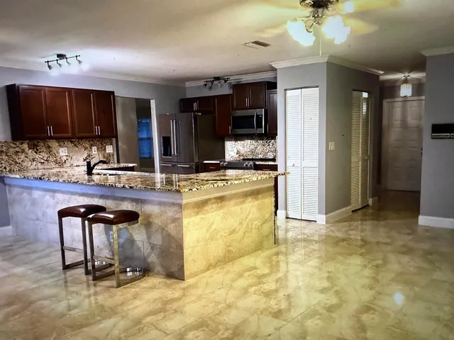 a view of a tree in front of a building