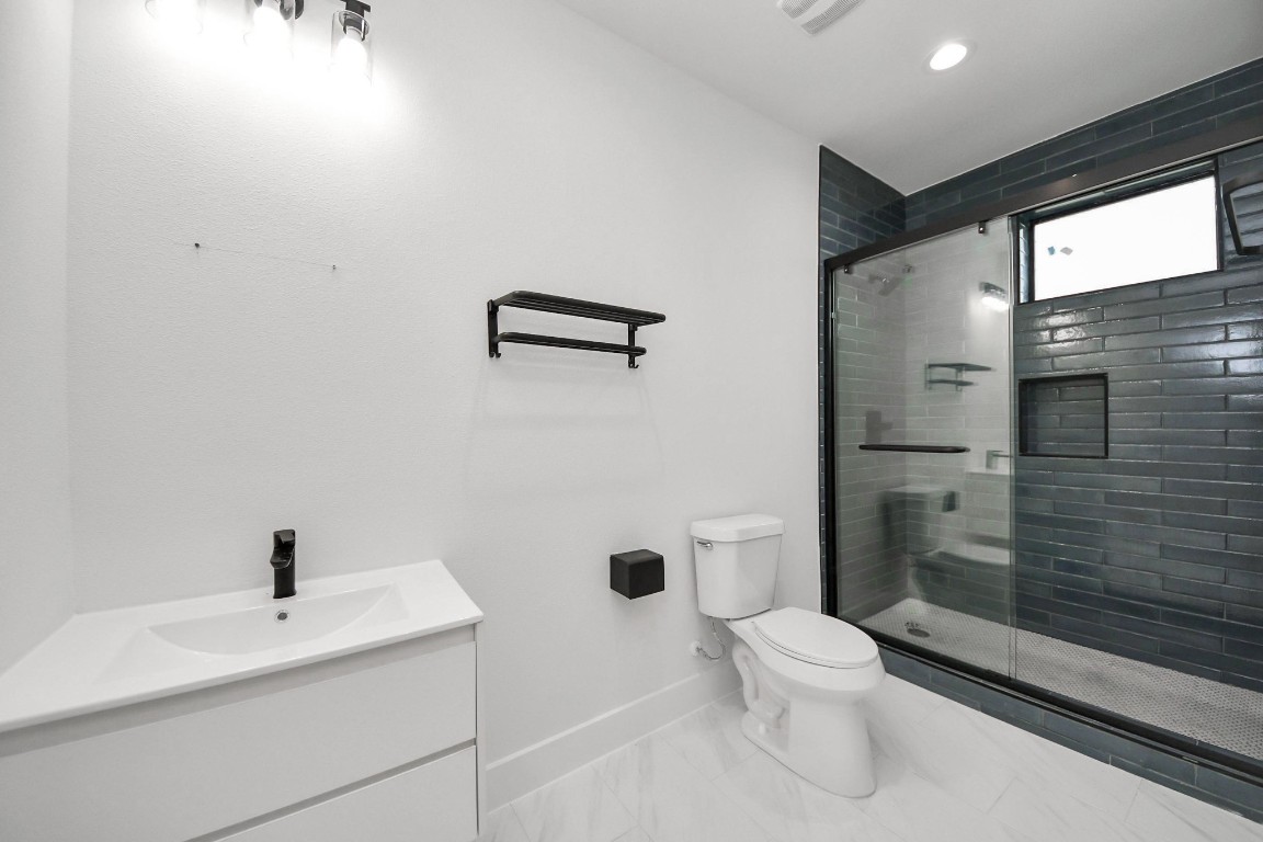 9022 Ferdinand Street Houston, TX 77051 - Photo 6 of 25 Slate blue guest bath vibes - calm, cute and ready to impress!