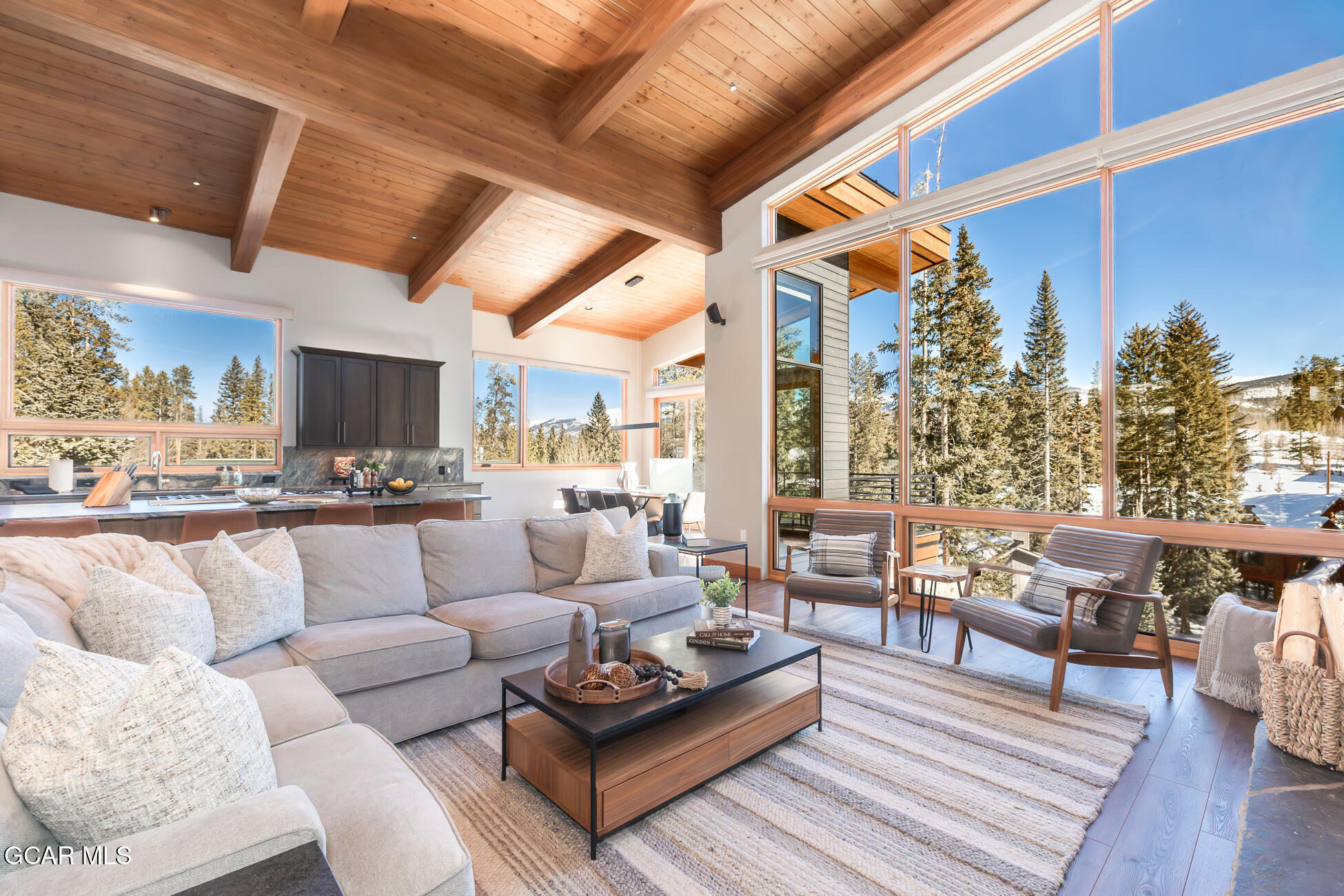 684 Vasquez Road Winter Park, CO 80482 - Photo 7 of 45 a living room with furniture kitchen view and a large window