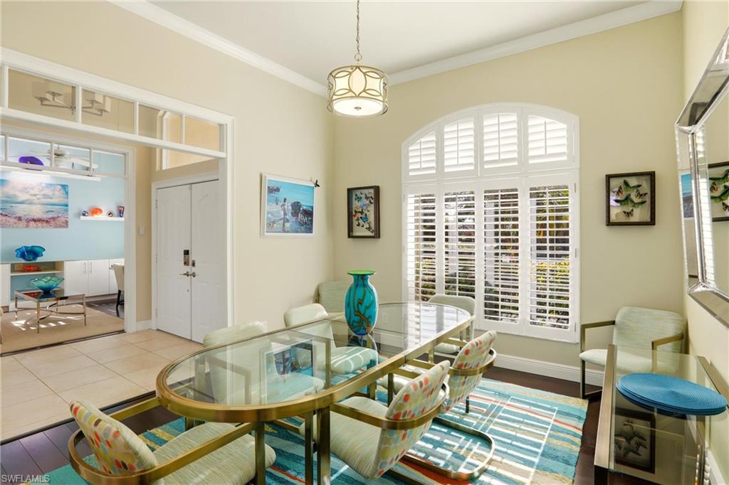 11180 Phoenix Way Naples, FL 34119 - Photo 13 of 43 Dining area with ornamental molding and baseboards