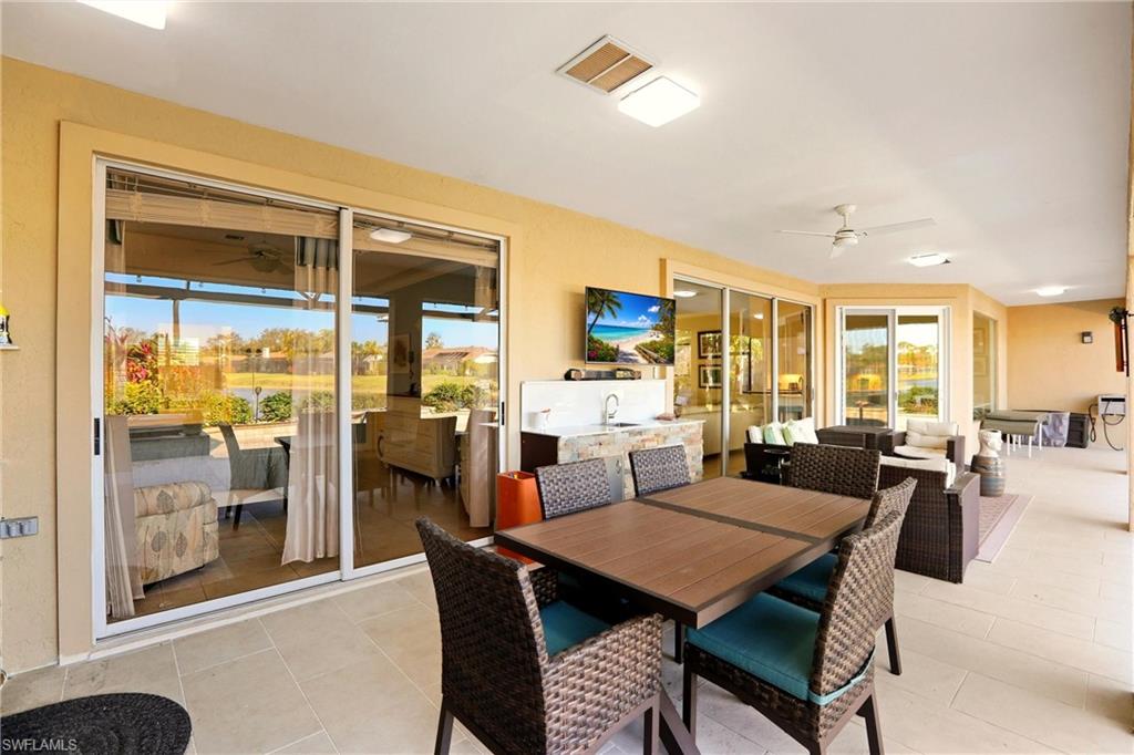 11180 Phoenix Way Naples, FL 34119 - Photo 27 of 43 Dining area with ceiling fan and light tile patterned flooring