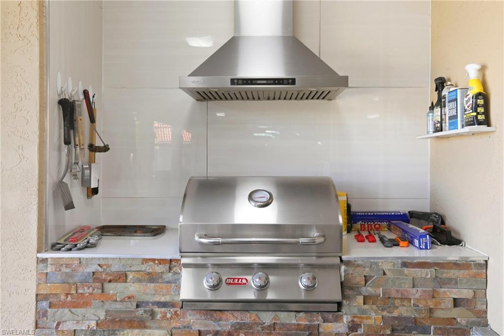 11180 Phoenix Way Naples, FL 34119 - Photo 28 of 43 Kitchen with ventilation hood