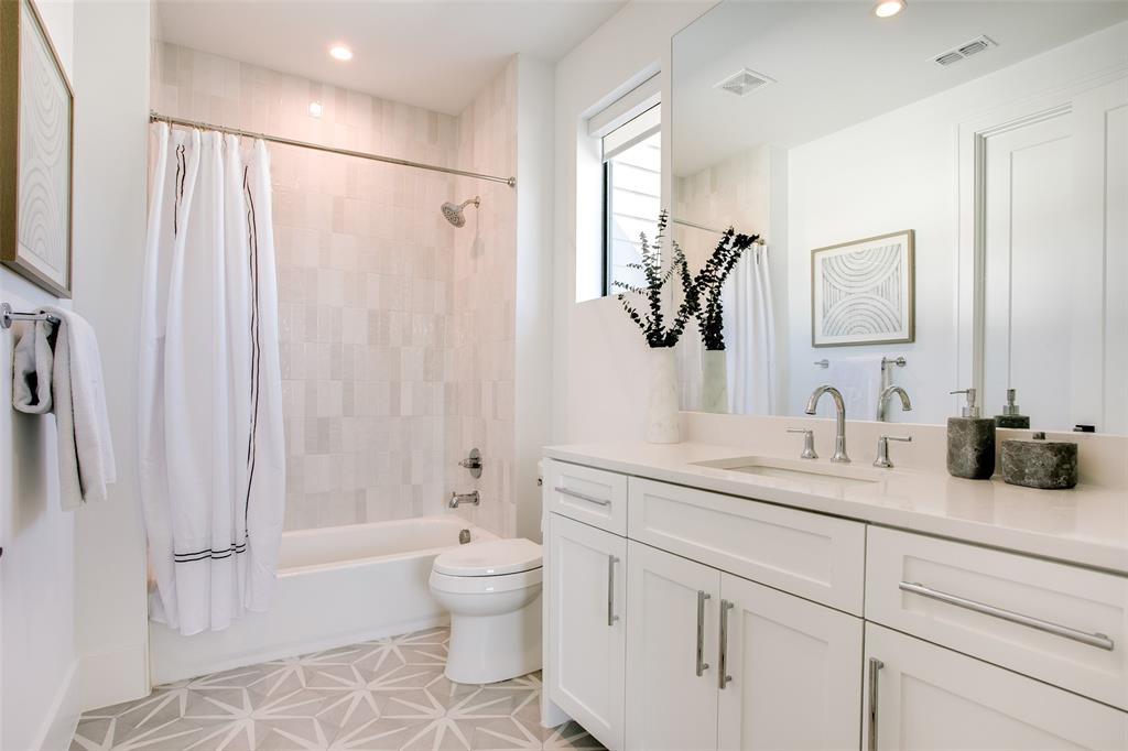 9721 Kerrisdale Lane Dallas, TX 75230 - Photo 13 of 25 a bathroom with a granite countertop sink a toilet and shower