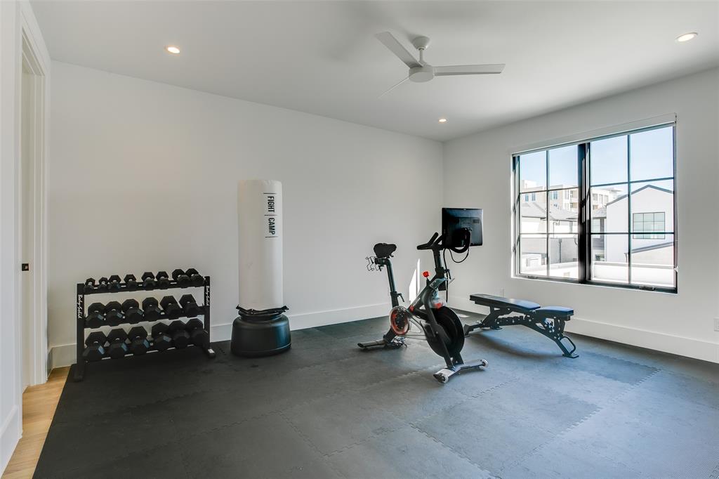 9721 Kerrisdale Lane Dallas, TX 75230 - Photo 14 of 25 a view of a room with gym equipment