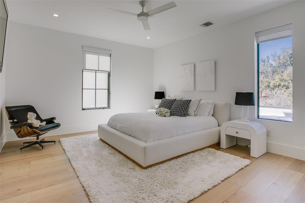 9721 Kerrisdale Lane Dallas, TX 75230 - Photo 16 of 25 a bedroom with a bed and window
