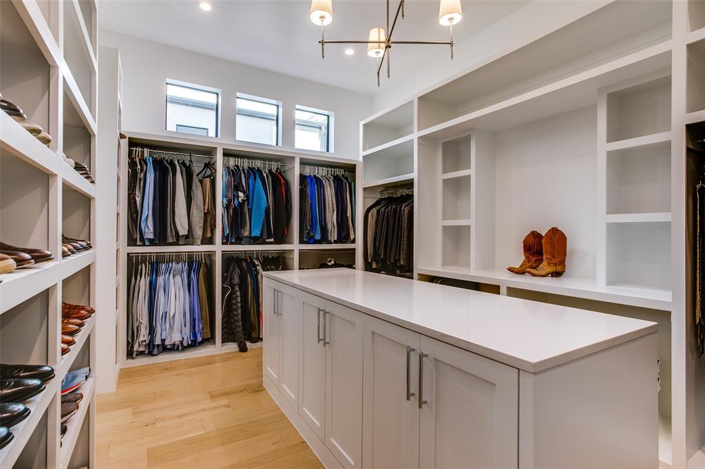 9721 Kerrisdale Lane Dallas, TX 75230 - Photo 8 of 25 a view of walk in closet with clothes and shoes