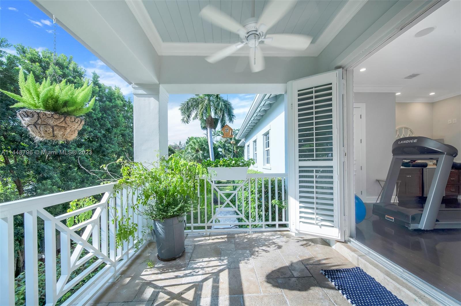 4270 Lennox Drive Miami, FL 33133 - Photo 21 of 39 a view of a porch with furniture and a potted plant