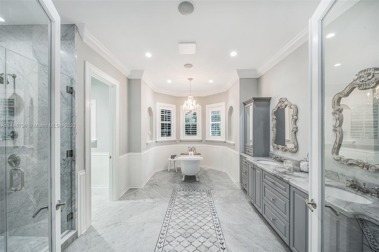 4270 Lennox Drive Miami, FL 33133 - Photo 23 of 39 a bathroom with a double vanity sink mirror and shower