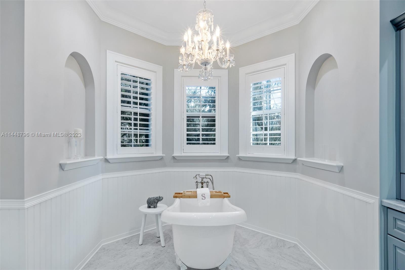 4270 Lennox Drive Miami, FL 33133 - Photo 24 of 39 a bathroom with a sink and a mirror