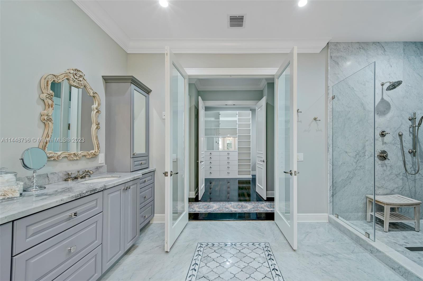4270 Lennox Drive Miami, FL 33133 - Photo 25 of 39 a bathroom with a double vanity sink toilet and shower