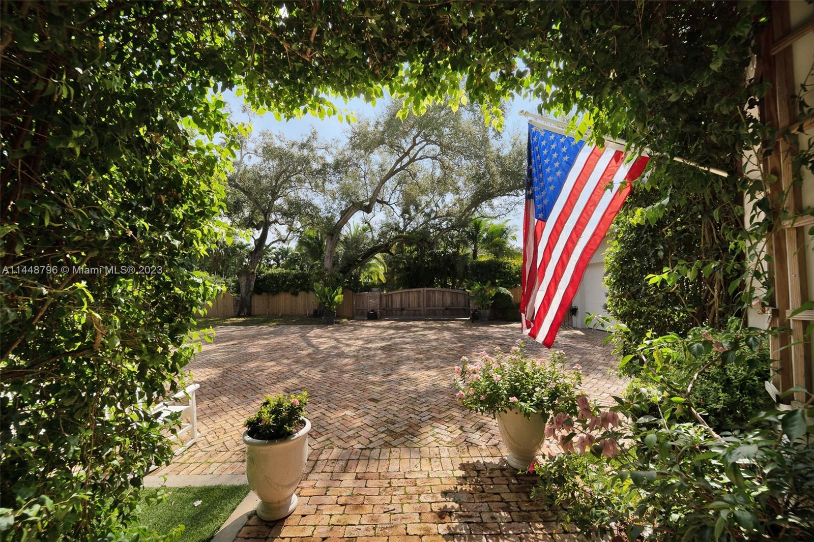 4270 Lennox Drive Miami, FL 33133 - Photo 3 of 39 a view of a backyard with swimming pool