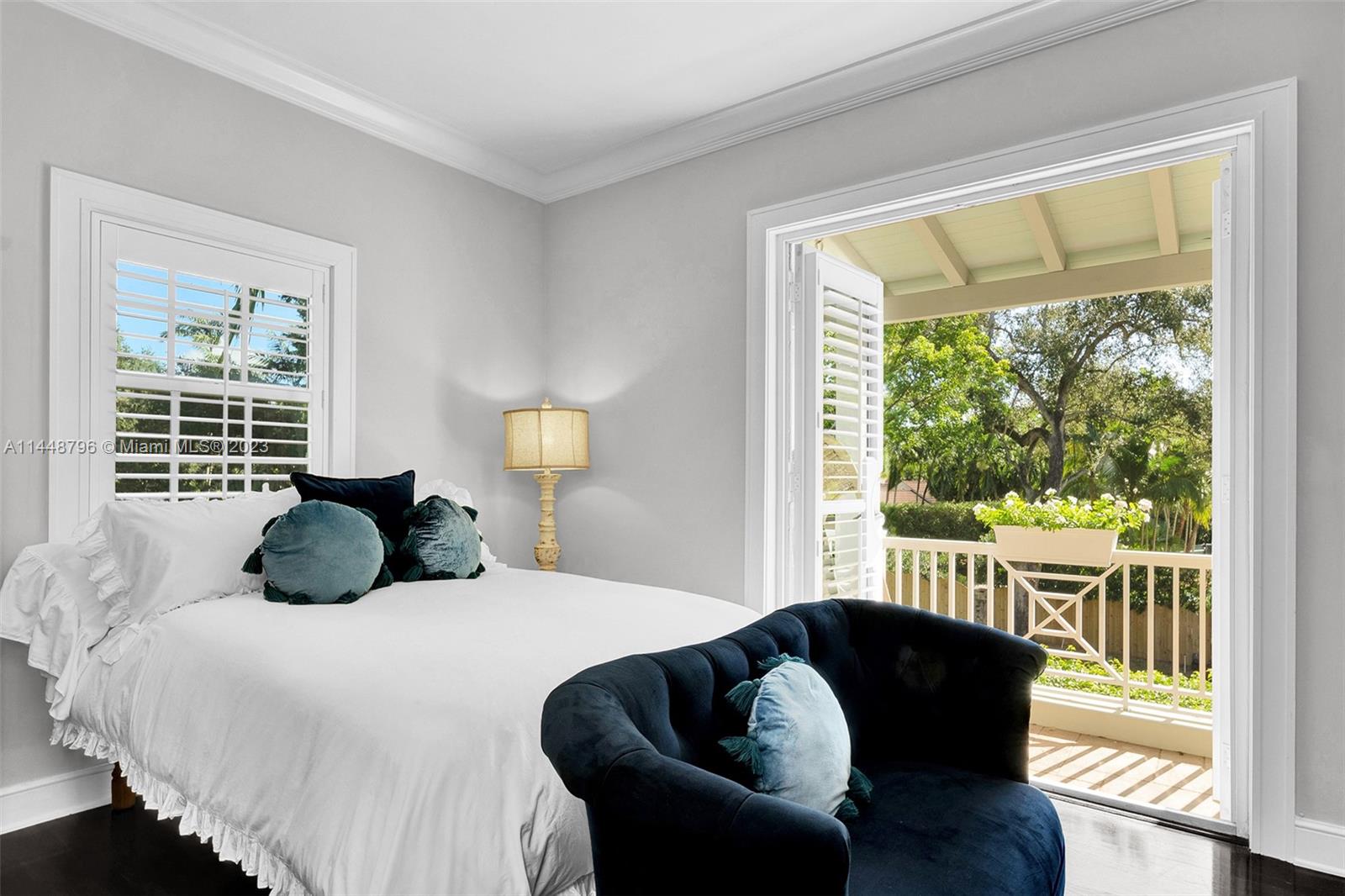 4270 Lennox Drive Miami, FL 33133 - Photo 31 of 39 a bedroom with a bed and a large window