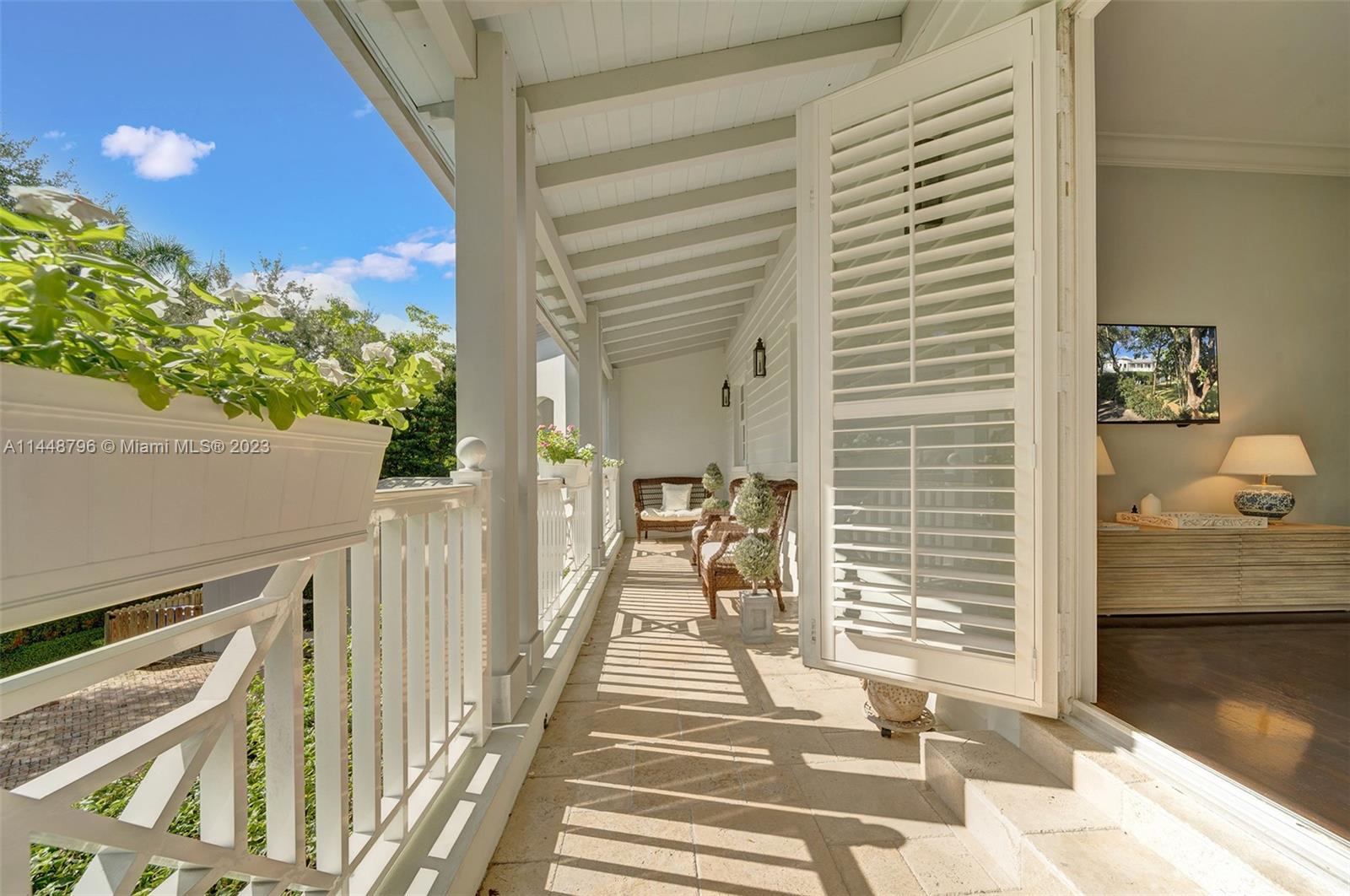 4270 Lennox Drive Miami, FL 33133 - Photo 32 of 39 a balcony view with a outdoor seating