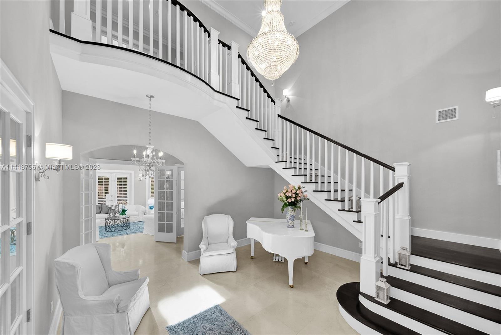 4270 Lennox Drive Miami, FL 33133 - Photo 6 of 39 a view of entryway and hall with wooden floor