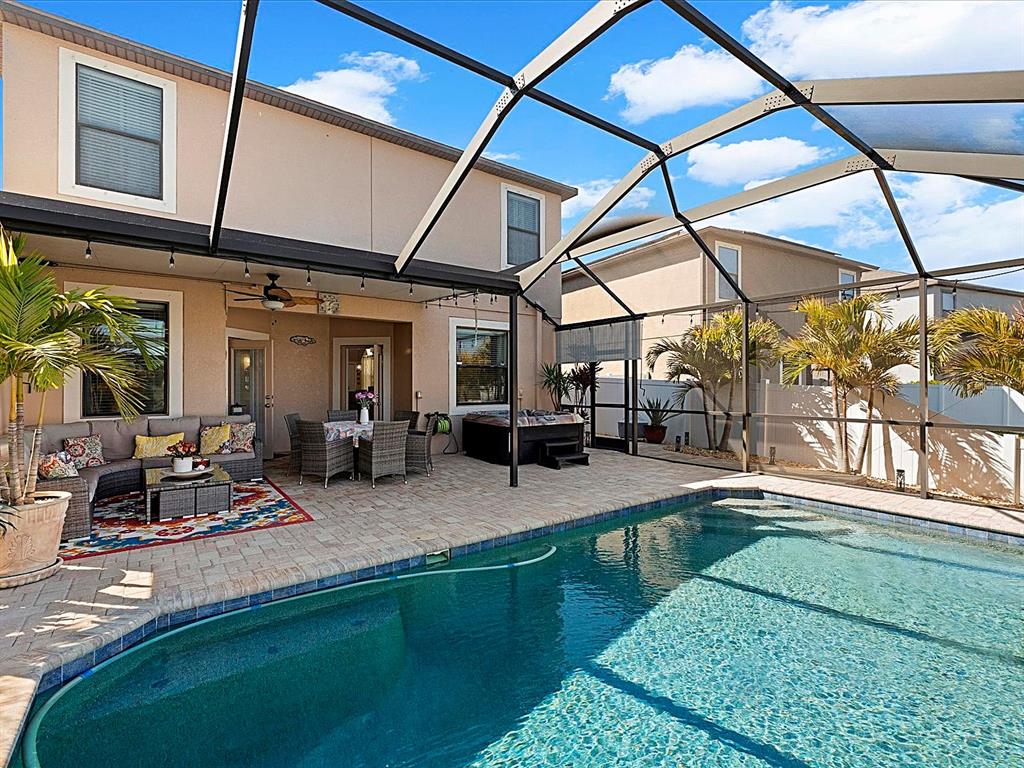 1716 Hadden Hall Place Trinity, FL 34655 - Photo 39 of 75 a view of a swimming pool with a patio