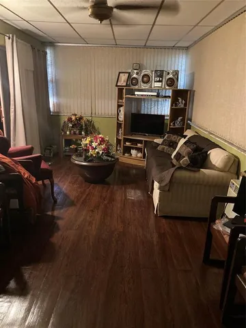 a living room with furniture a couch and a chandelier