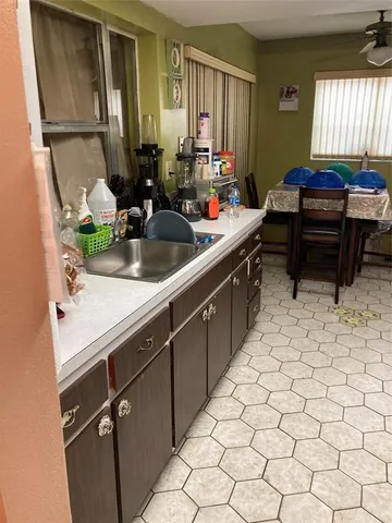 a room with furniture a window and a flat screen tv