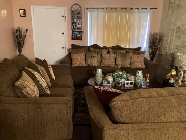a dining room with furniture and window