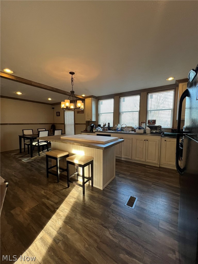 53720 Highway 681 Reedsville, OH 45772 - Photo 4 of 25 Spacious kitchen featuring wood-finish flooring, an island with beadboard paneling, and a dining area