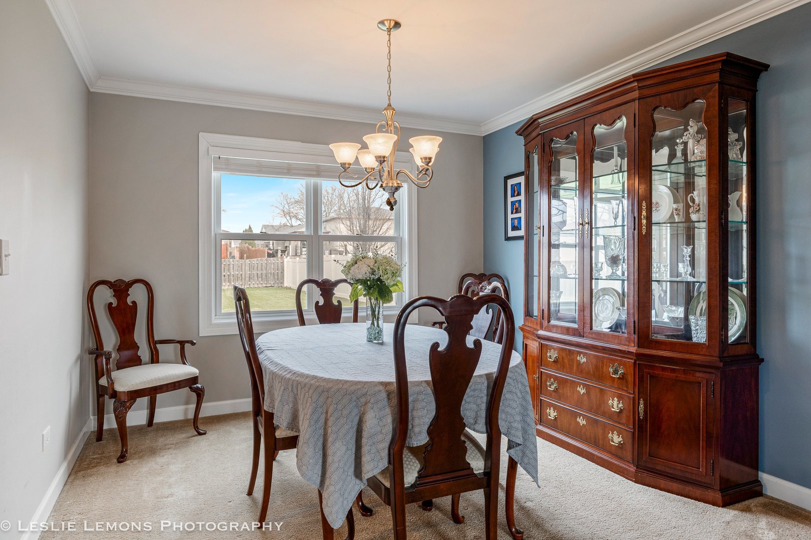 3432 Drover Lane Darien, IL 60561 - Photo 11 of 29 a dining room with furniture a chandelier and wooden floor