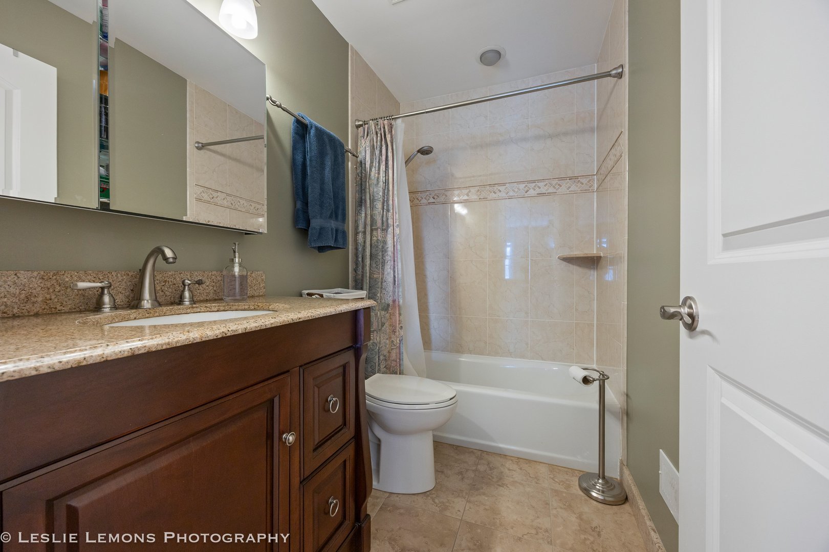 3432 Drover Lane Darien, IL 60561 - Photo 20 of 29 a bathroom with a granite countertop sink toilet and shower