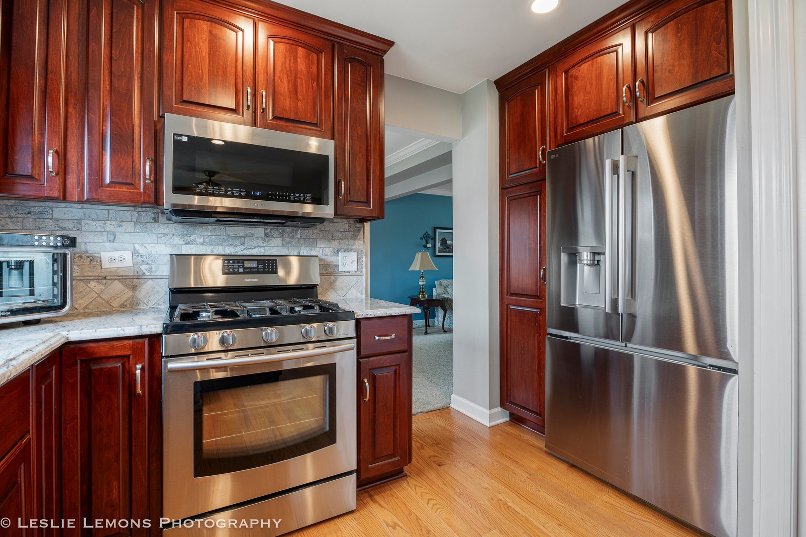 3432 Drover Lane Darien, IL 60561 - Photo 3 of 29 a kitchen with a stove microwave and a refrigerator
