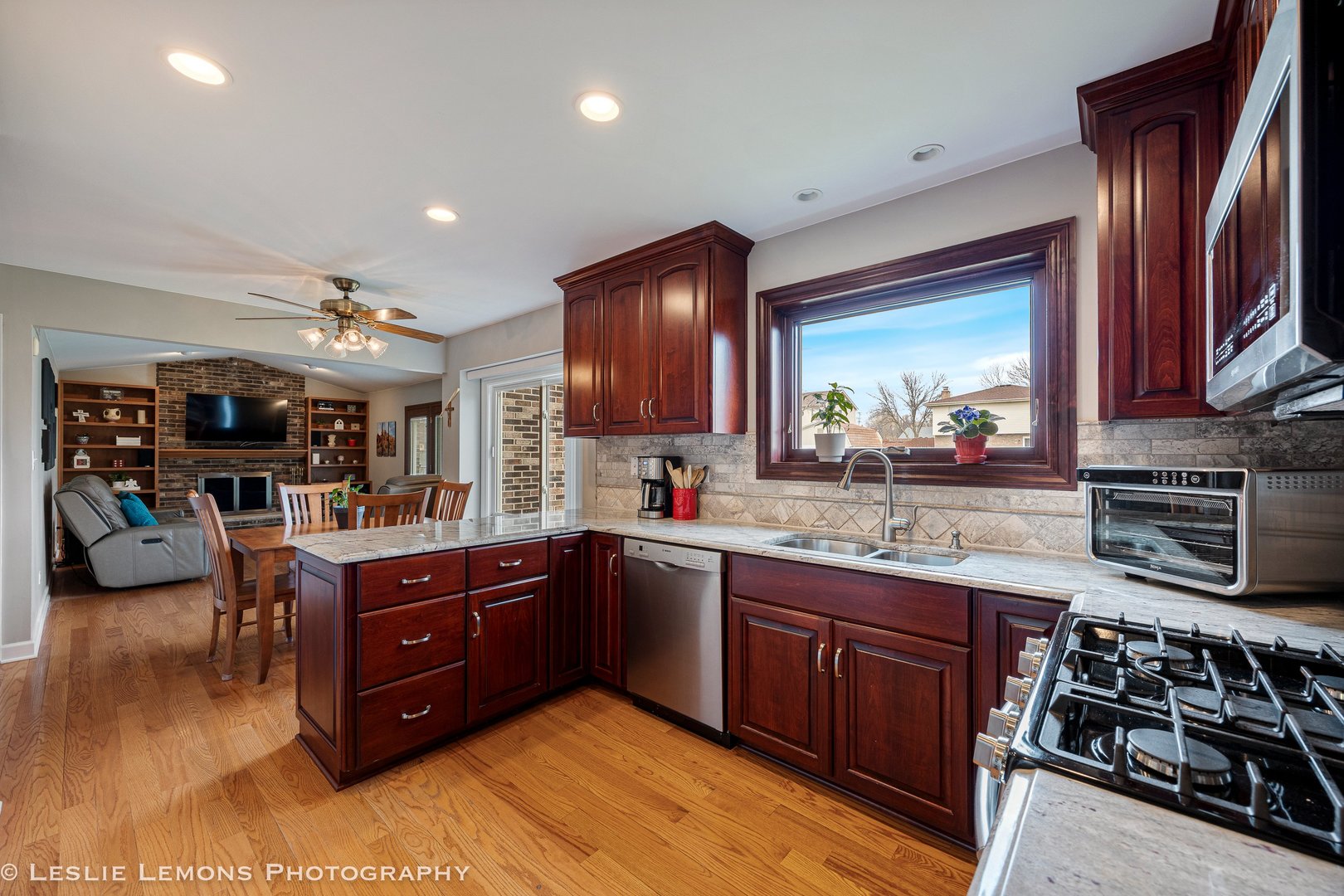 3432 Drover Lane Darien, IL 60561 - Photo 7 of 29 a kitchen with stainless steel appliances granite countertop a stove and a sink