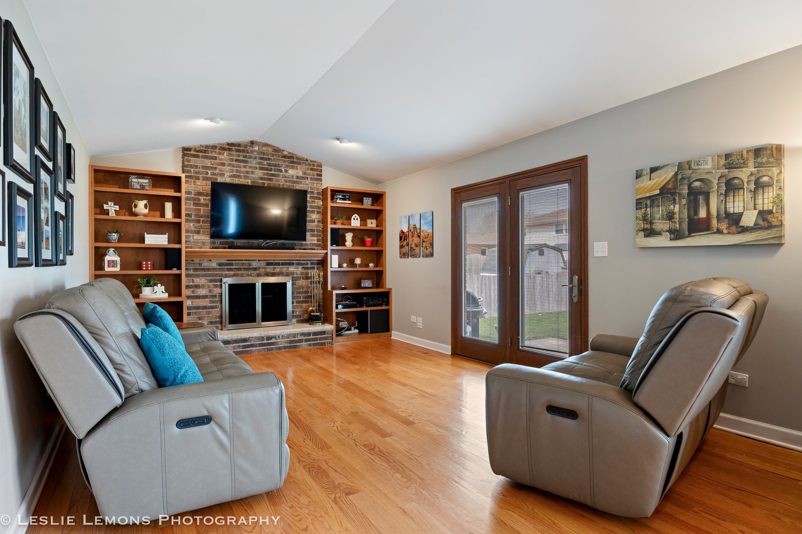 3432 Drover Lane Darien, IL 60561 - Photo 10 of 29 a living room with furniture a flat screen tv and a fireplace