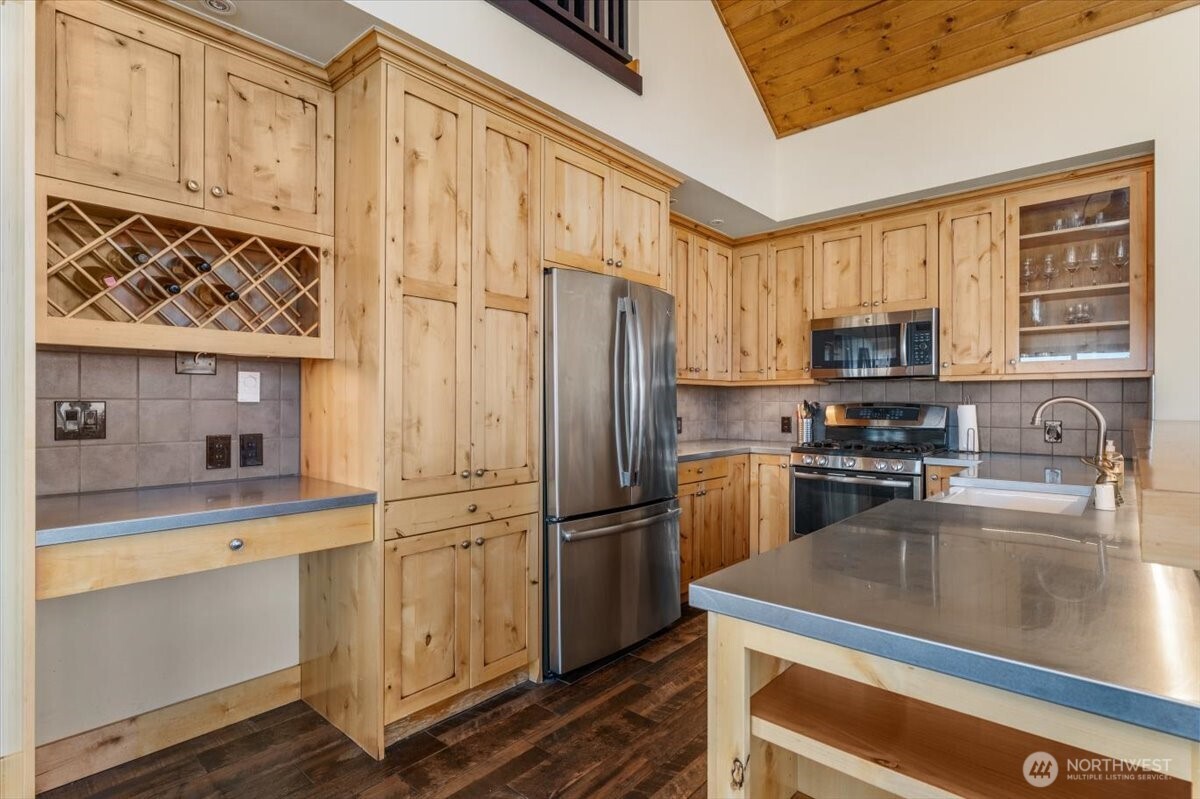 420 Plata Road Brewster, WA 98812 - Photo 11 of 36 a kitchen with a refrigerator stove and microwave