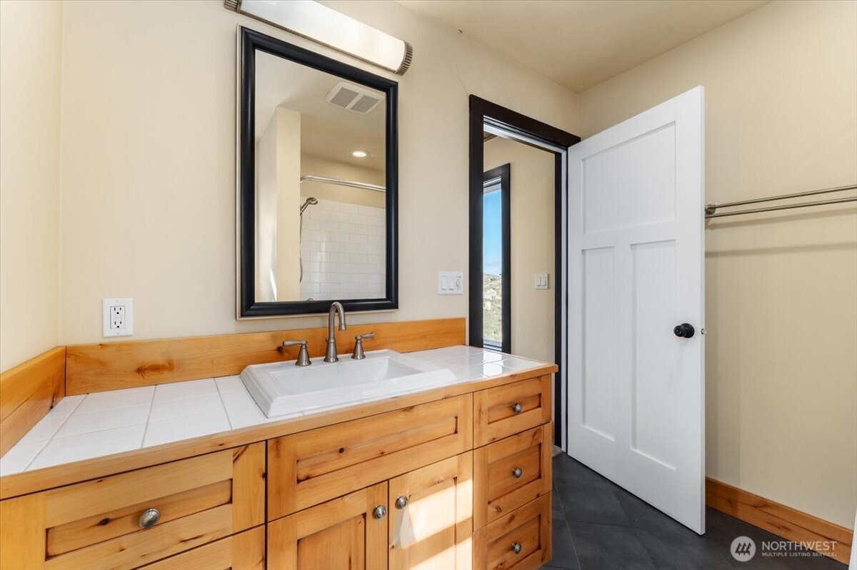 420 Plata Road Brewster, WA 98812 - Photo 19 of 36 a bathroom with a sink and a mirror
