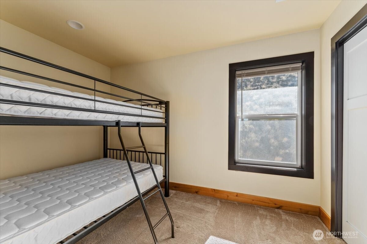 420 Plata Road Brewster, WA 98812 - Photo 20 of 36 a bedroom with a bed and a window