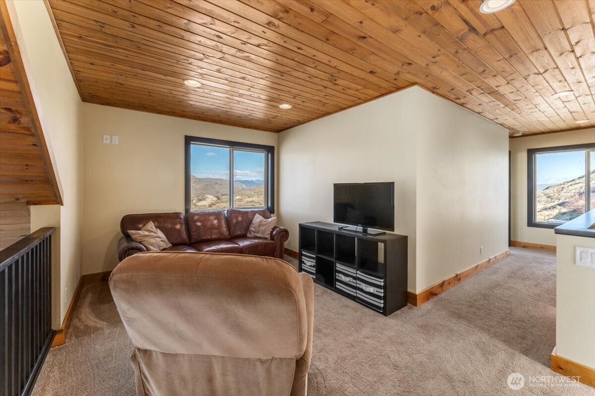 420 Plata Road Brewster, WA 98812 - Photo 21 of 36 a living room with furniture and a flat screen tv