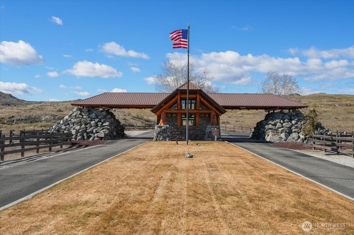 420 Plata Road Brewster, WA 98812 - Photo 30 of 36 a front view of a house with a yard and mountain view in back