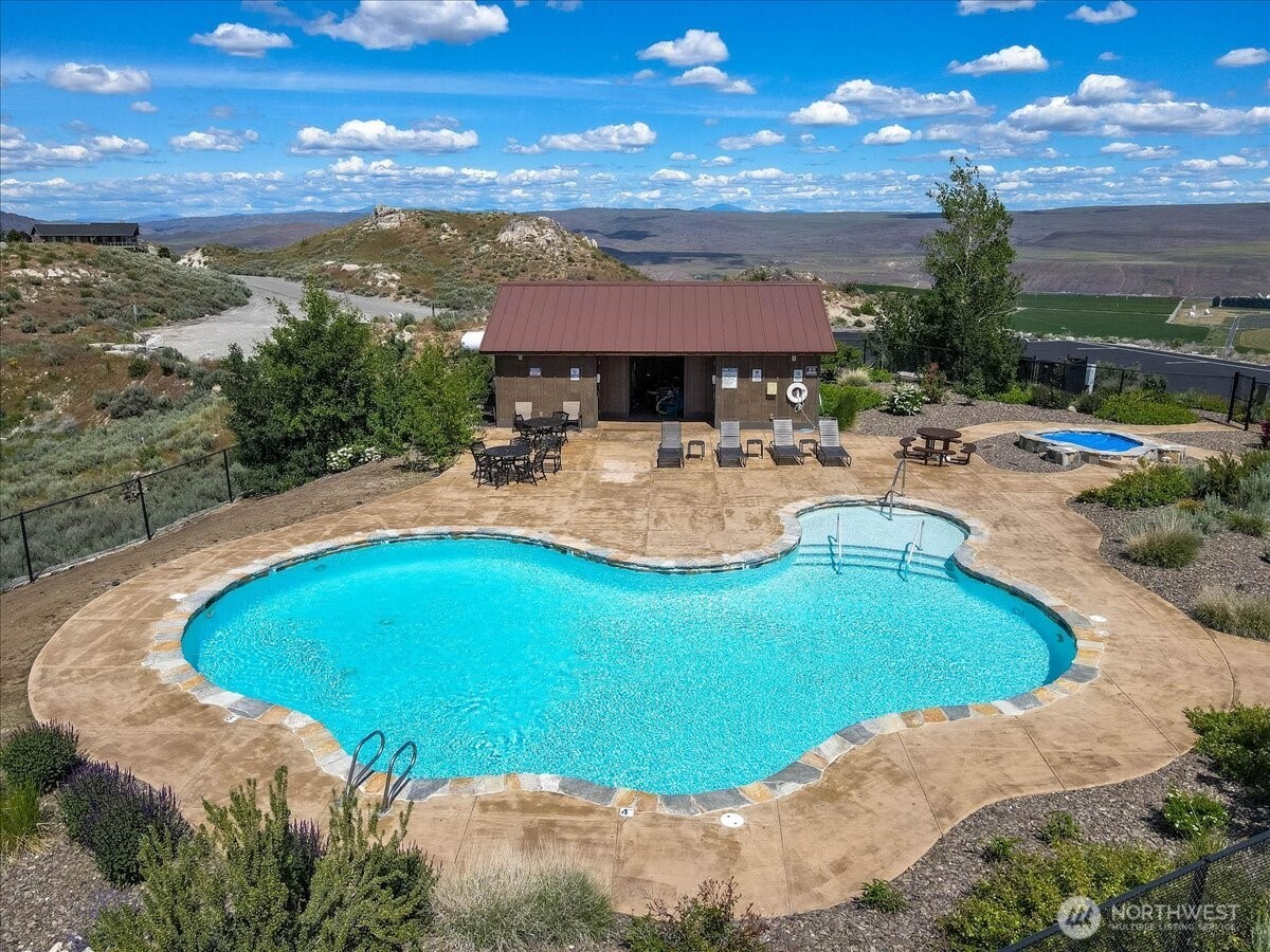 420 Plata Road Brewster, WA 98812 - Photo 32 of 36 a view of a swimming pool with lounge chair