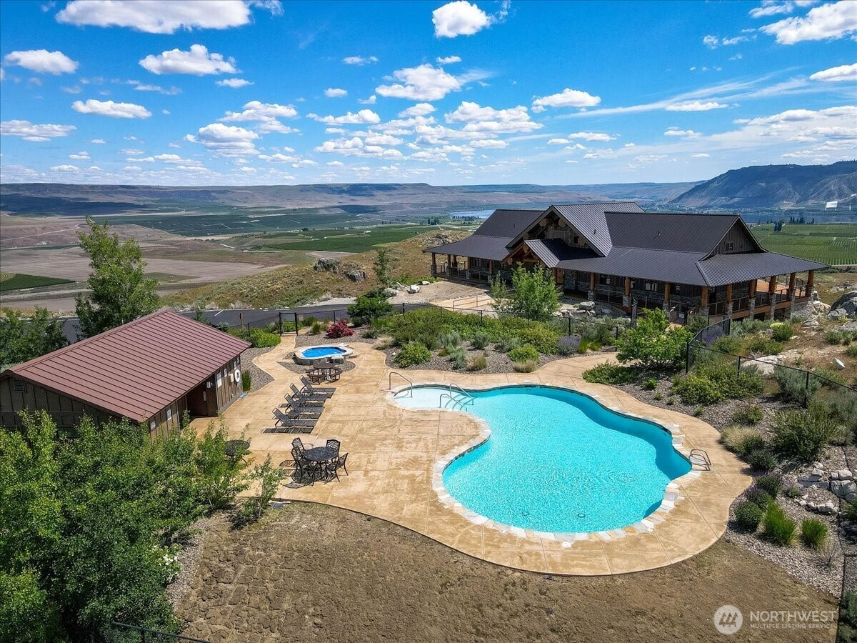 420 Plata Road Brewster, WA 98812 - Photo 33 of 36 a view of a swimming pool with a yard