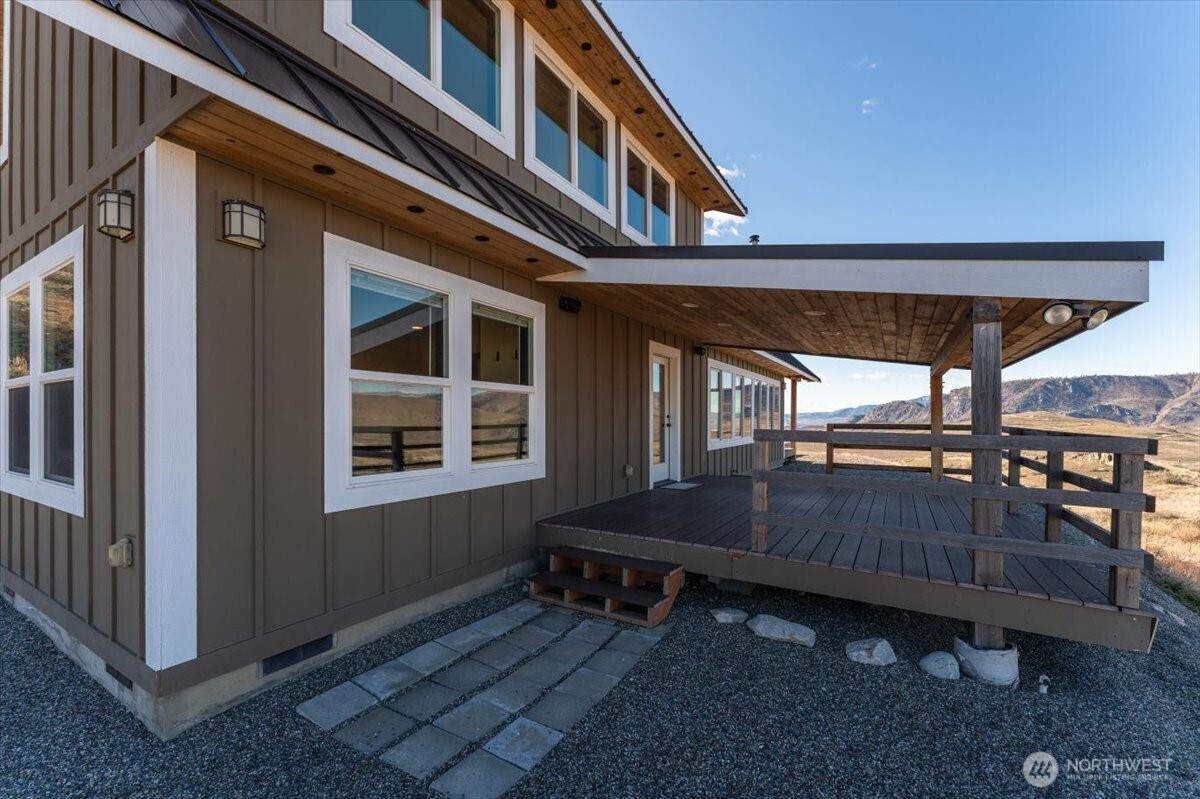 420 Plata Road Brewster, WA 98812 - Photo 5 of 36 a backyard of a house with barbeque oven table and chairs