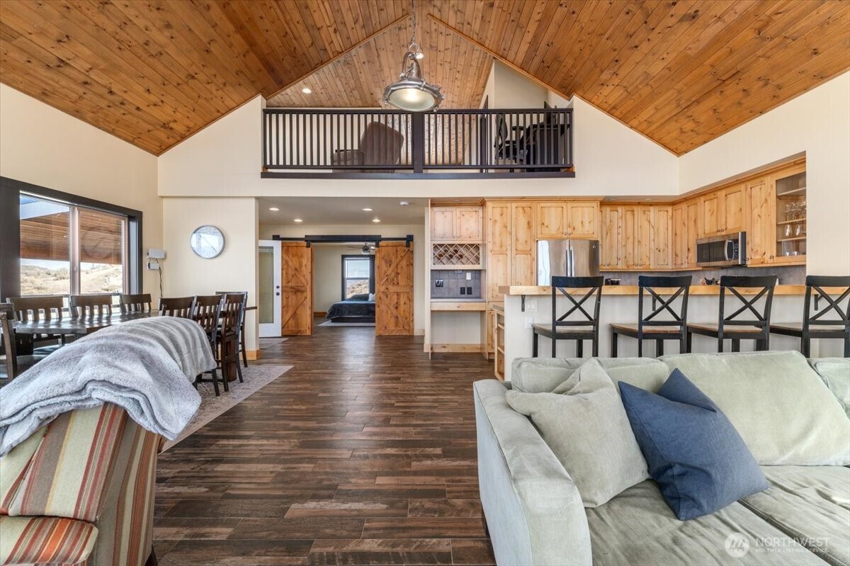420 Plata Road Brewster, WA 98812 - Photo 6 of 36 a living room with furniture a wooden floor and next to a window