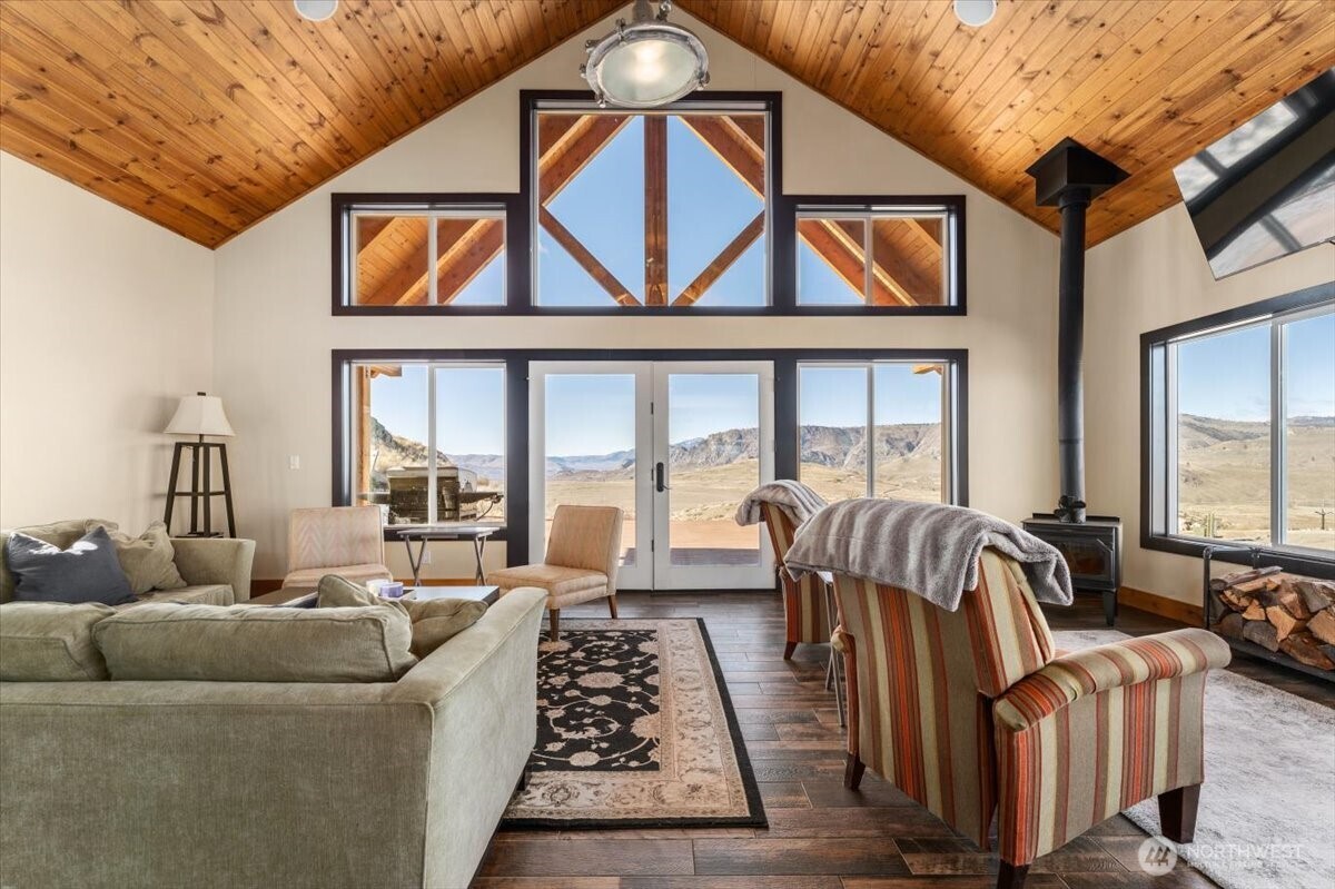 420 Plata Road Brewster, WA 98812 - Photo 7 of 36 a living room with furniture and a floor to ceiling window