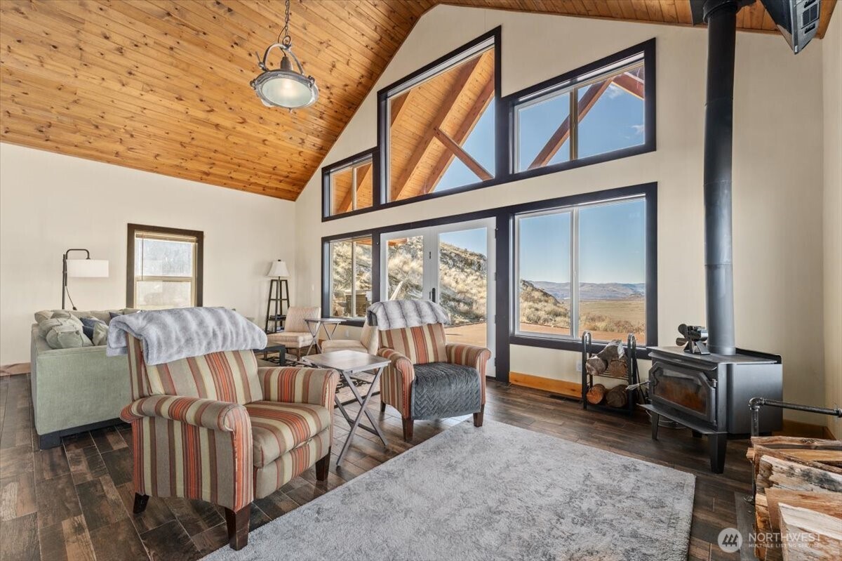 420 Plata Road Brewster, WA 98812 - Photo 9 of 36 a living room with furniture and a large window