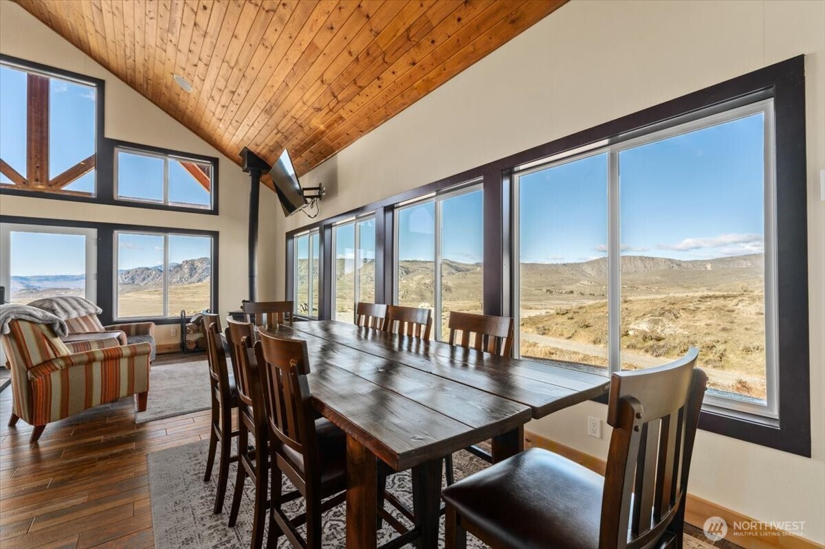420 Plata Road Brewster, WA 98812 - Photo 10 of 36 a view of a dining room with furniture window and wooden floor