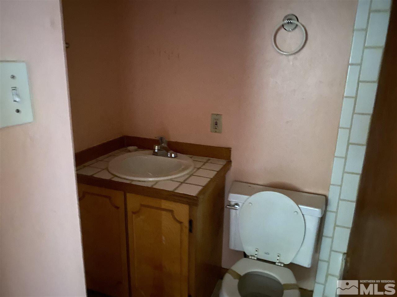 3445 Rauscher Drive Reno, NV 89503 - Photo 4 of 12 a bathroom with a sink and a toilet