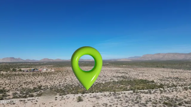 a view of a backyard with a ocean view