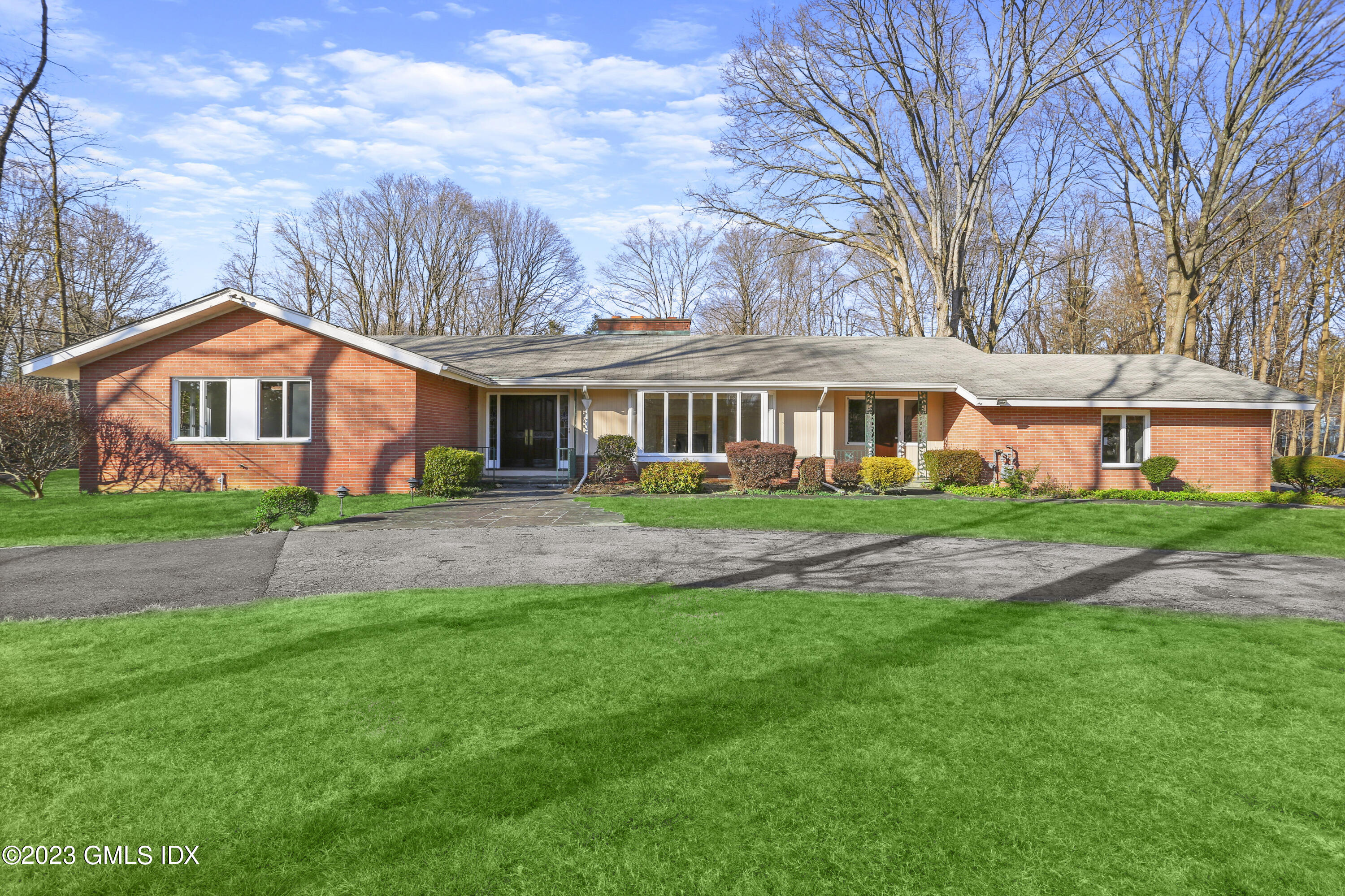 front view of a house with a yard