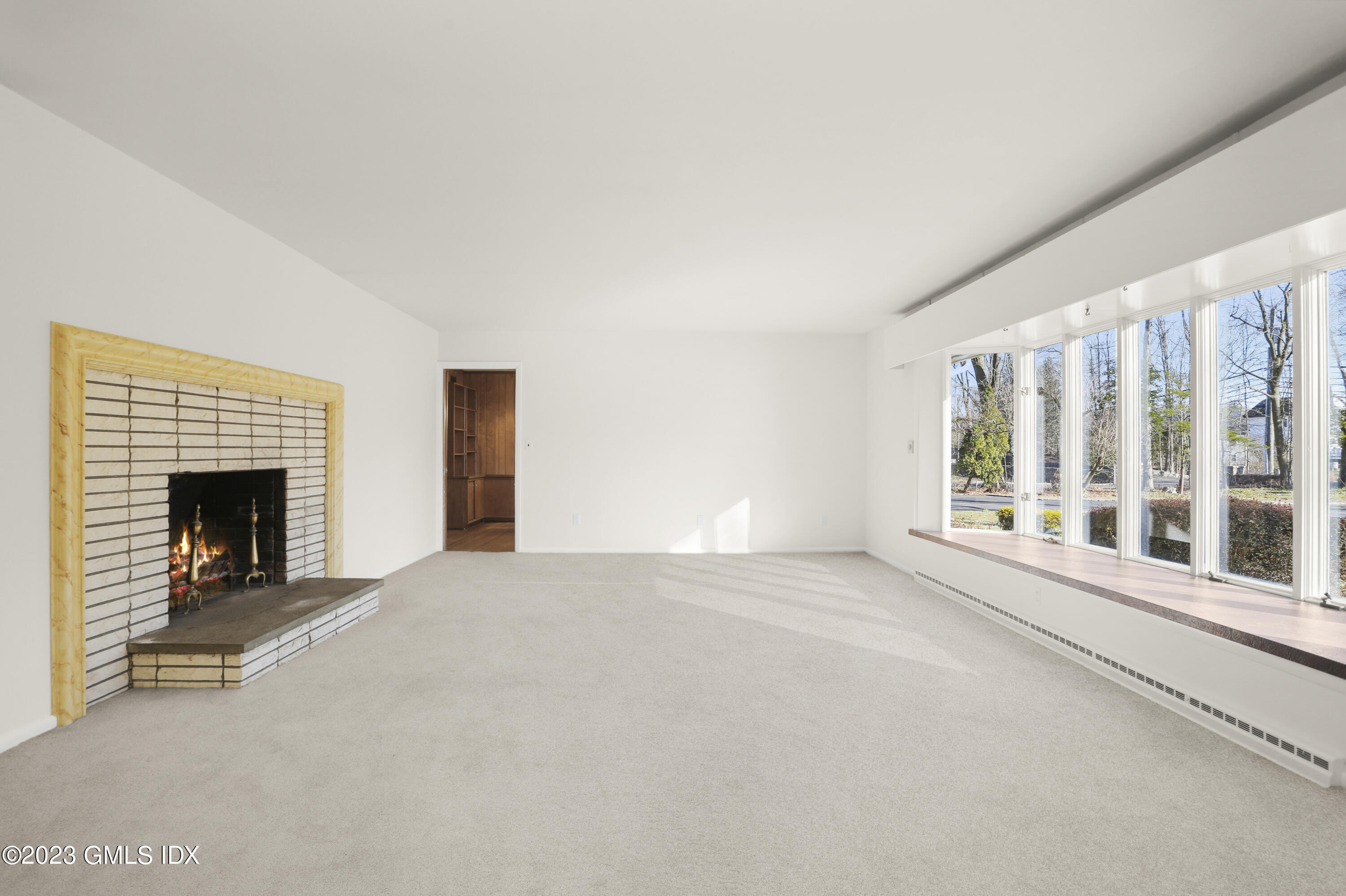 28 Intervale Road Stamford, CT 06905 - Photo 4 of 20 a view of an empty room with a fireplace