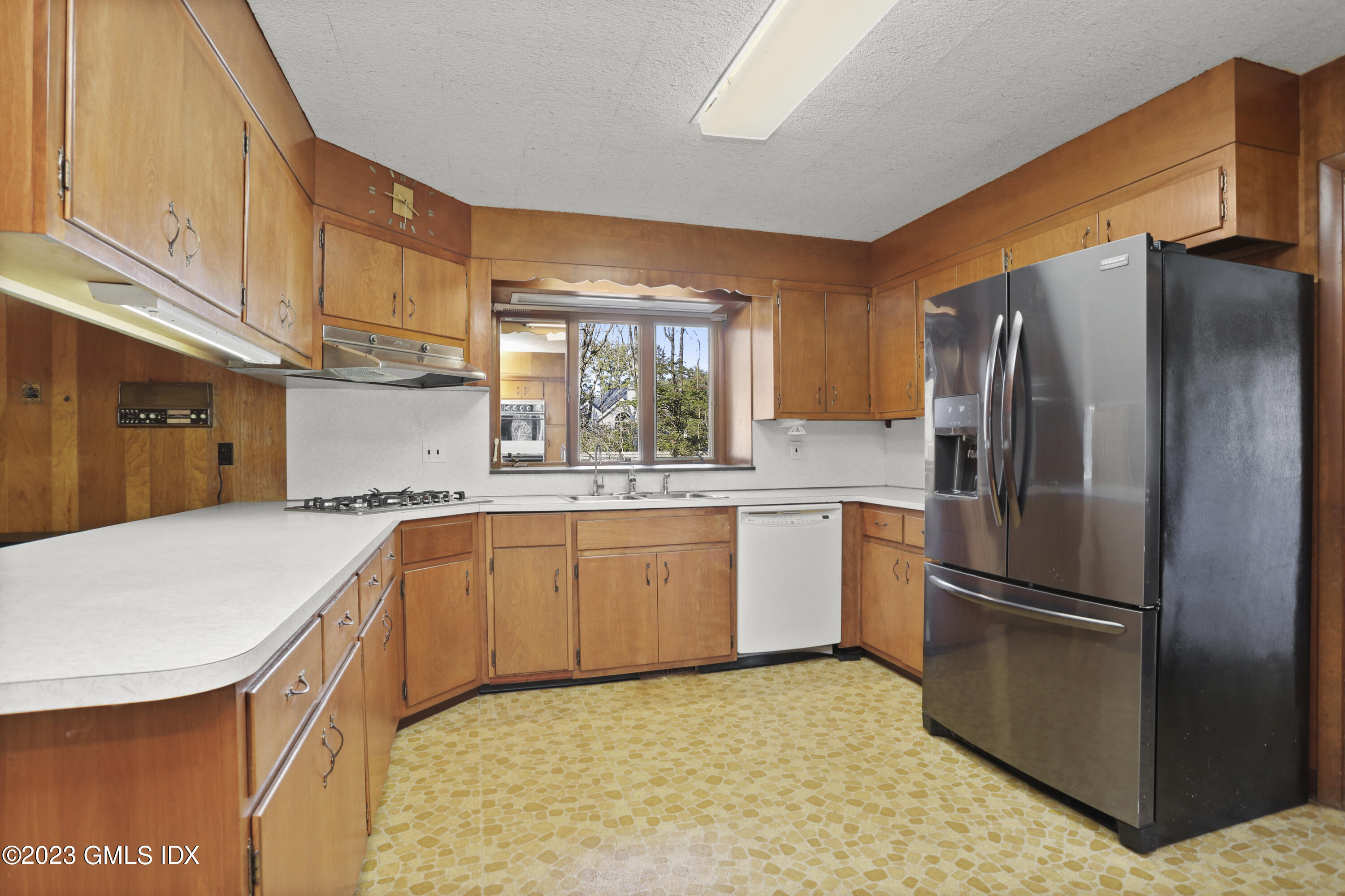 28 Intervale Road Stamford, CT 06905 - Photo 6 of 20 a kitchen with granite countertop a refrigerator and a sink