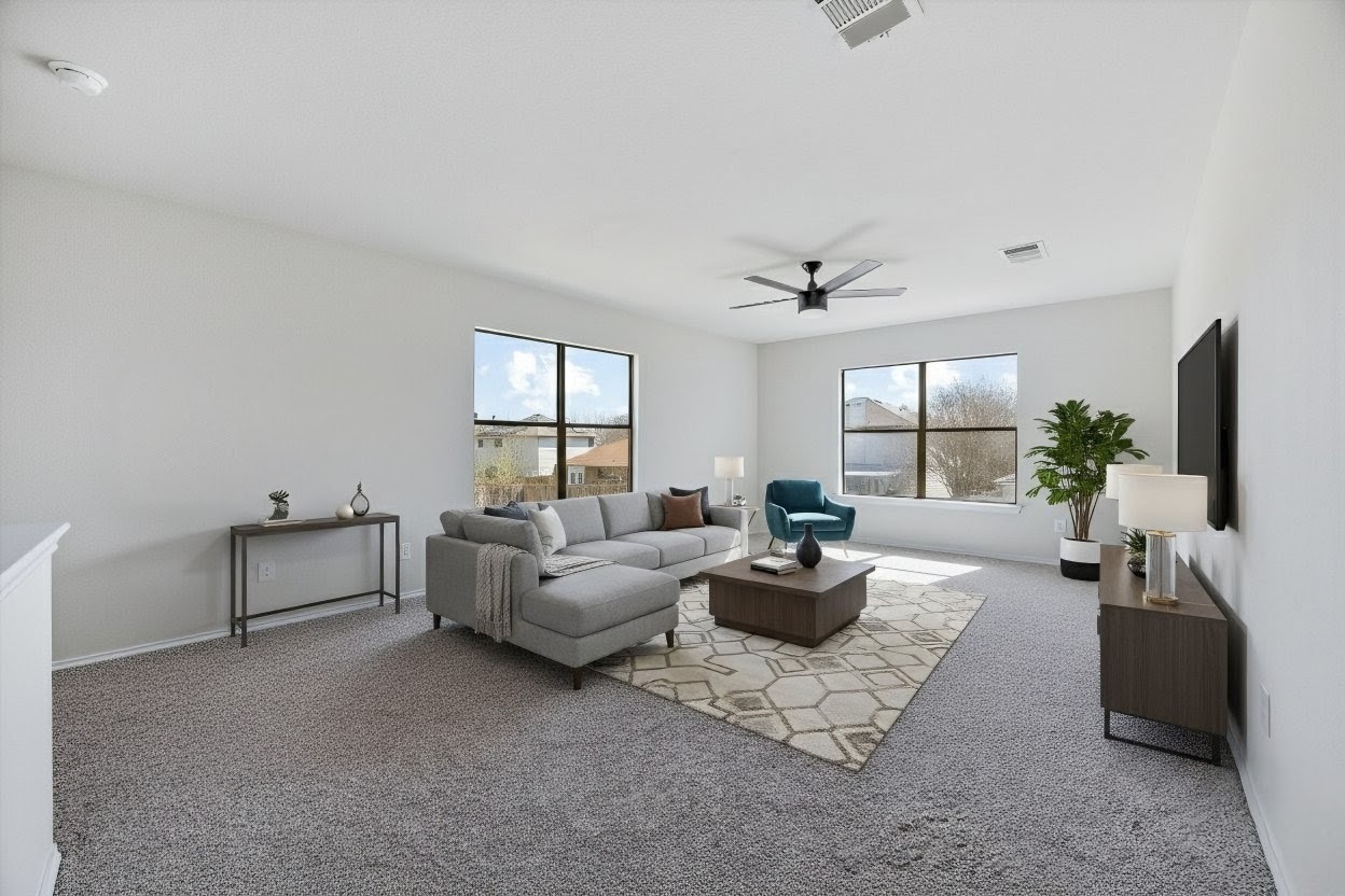 7541 Redrick Drive Austin, TX 78747 - Photo 7 of 40 Living room with carpet floors and ceiling fan