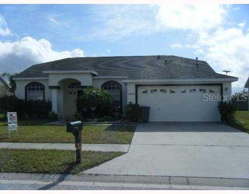 24600 Laurel Ridge Drive Lutz, FL 33559 - Photo 1 of 1 front view of a house with a yard