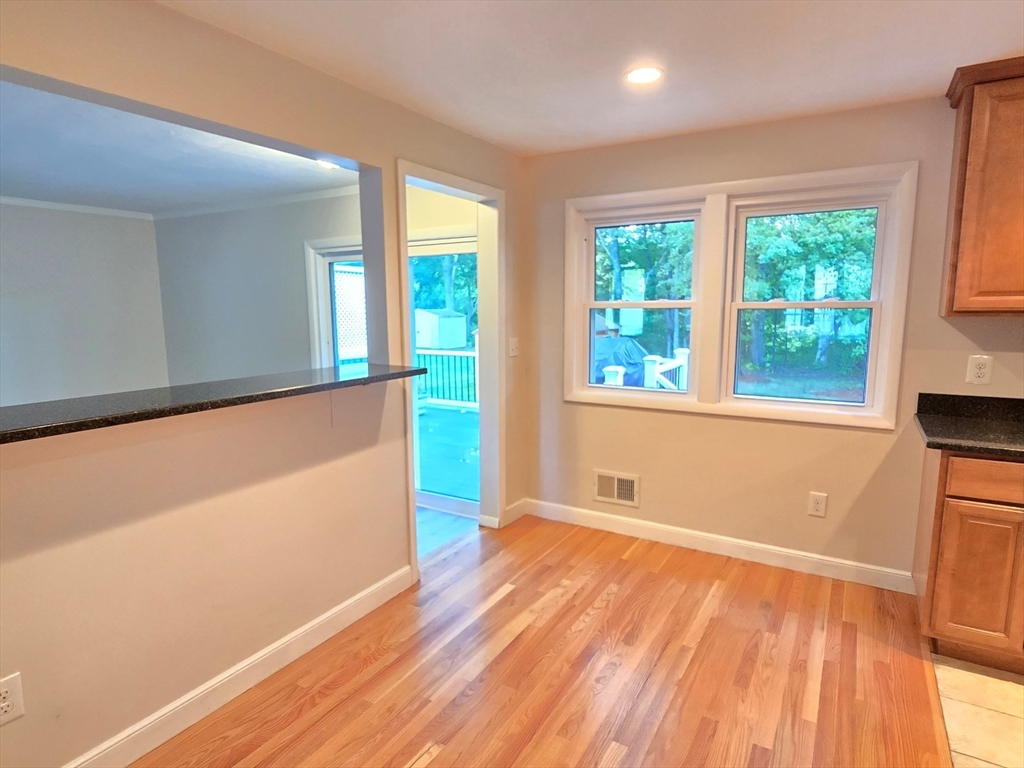 26 Wenzell Road Ashland, MA 01721 - Photo 16 of 33 an empty room with wooden floor and windows