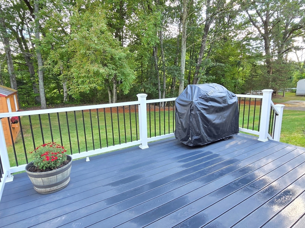 26 Wenzell Road Ashland, MA 01721 - Photo 6 of 33 a view of a small deck and a garden